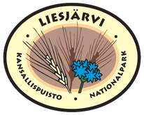 Liesjärven kansallsipuistomerkissä on rukiin tähkä ja ruiskaunokki.